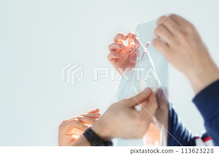 Installation of tinted film. Ultraviolet and energy afficiency concept. 113623228