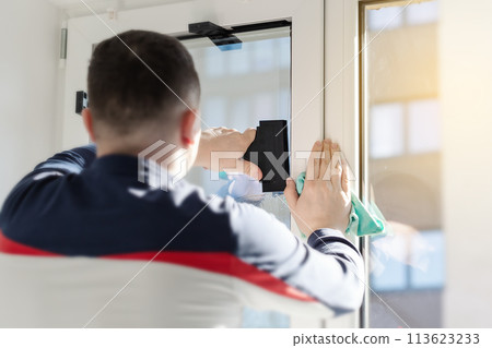 Installation of tinted film. Ultraviolet and energy afficiency concept. 113623233