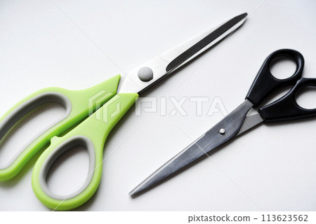 Sewing scissors on a white background. Green scissors. Sewing scissors on a white background. Green scissors. 113623562