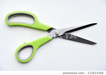 Sewing scissors on a white background. Green scissors. 113623566