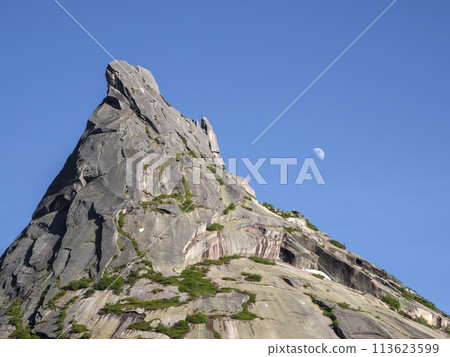 Moon over the sharp rock. Moon over the sharp rock. 113623599