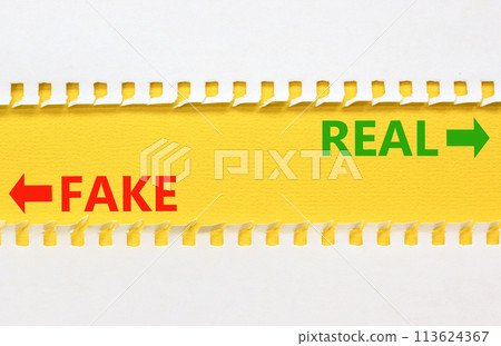 Real or fake symbol. Concept word Real or Fake on beautiful yellow paper. Beautiful white paper background. Business and real or fake concept. Copy space. 113624367