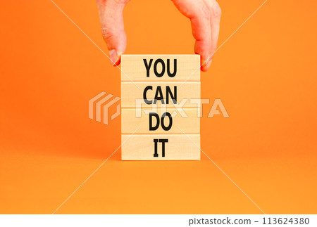 You can do it symbol. Concept word You can do it on beautiful wooden block. Beautiful orange table orange background. Businessman hand. Business motivational you can do it concept. Copy space. You can do it symbol. Concept word You can do it on beautiful wooden block. Beautiful orange table orange background. Businessman hand. Business motivational you can do it concept. Copy space. 113624380