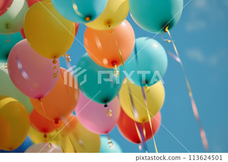 Bunch of colorful helium balloons are floating in blue sky 113624501
