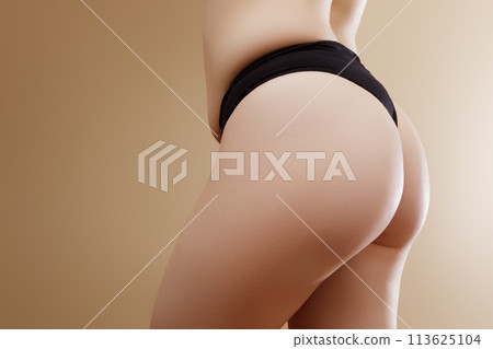 Back view of crop anonymous plump female in black 113625104