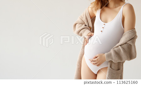 A beautiful pregnant girl in a white bodysuit and A beautiful pregnant girl in a white bodysuit and 113625160