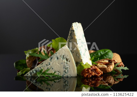 Blue cheese with walnuts and fresh greens. Blue cheese with walnuts and fresh greens. 113625422