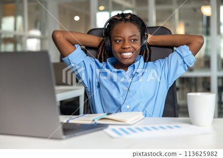 Cheerful woman call center operator having break during her work Cheerful woman call center operator having break during her work 113625982