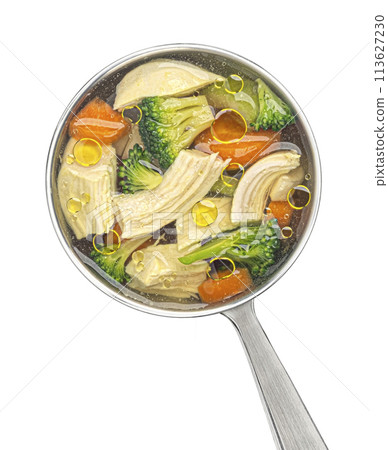 Ladle with chicken soup with vegetables isolated on white background, top view, package design element 113627230