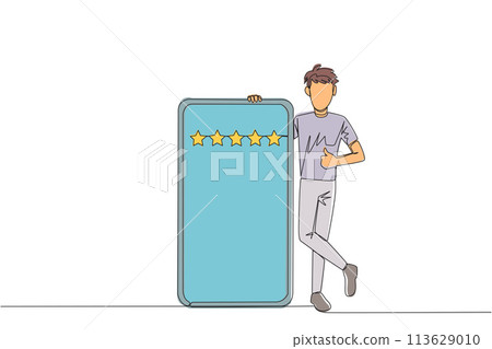Single one line drawing young happy smiling man stands casually next to a large smartphone, other hand giving a thumbs up gesture. Give review 5 star. Continuous line design graphic illustration 113629010