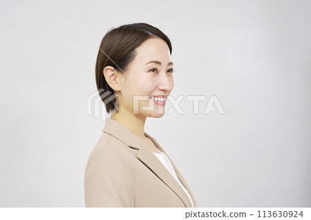 Portrait of a smiling businesswoman on white background Portrait of a smiling businesswoman on white background 113630924