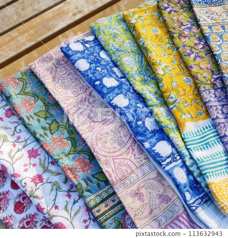 Colorful fabrics for sale at a market stall in the Provence, France Colorful fabrics for sale at a market stall in the Provence, France 113632943