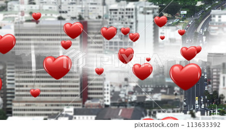 Cityscape with flying heart icons in the foreground 113633392