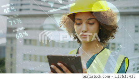 Architect reviews data on tablet outside 113633435