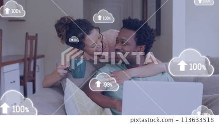 Image of cloud icons over african american couple using laptop Image of cloud icons over african american couple using laptop 113633518