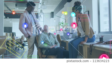 Image of media icons over diverse business people in office Image of media icons over diverse business people in office 113634223