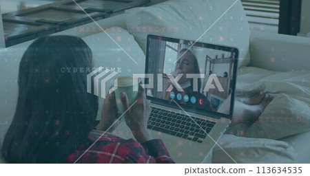 Cyber security data processing against woman having a image call on laptop at home Cyber security data processing against woman having a image call on laptop at home 113634535