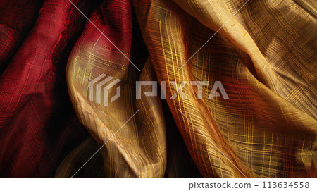 Elegant drapery of red and gold fabrics, a high quality photo of sumptuous textiles 113634558