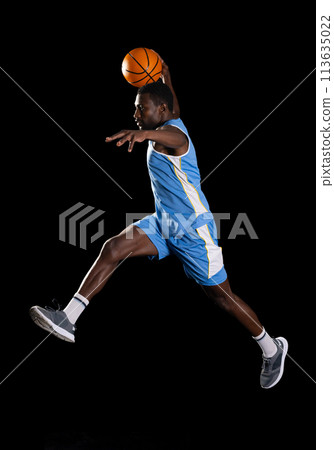 African American man in mid-air basketball action 113635022