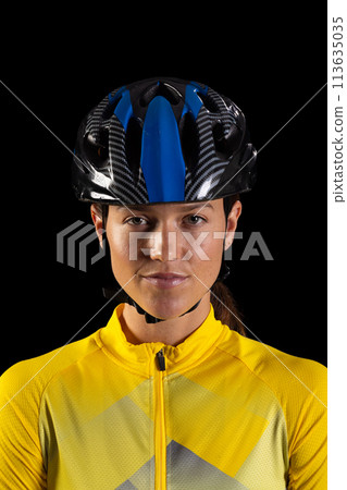 Young Caucasian woman wearing a cycling helmet, with copy space Young Caucasian woman wearing a cycling helmet, with copy space 113635035