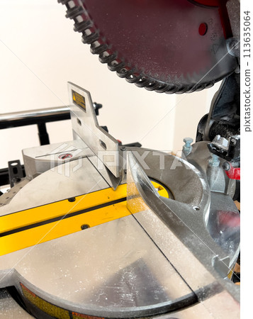 Get up close with the advanced features of a double bevel sliding miter saw, perfect for accurate and clean cuts in woodworking projects. Get up close with the advanced features of a double bevel sliding miter saw, perfect for accurate and clean cuts in woodworking projects. 113635064