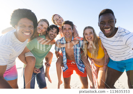 Diverse group of friends enjoy a day at the beach Diverse group of friends enjoy a day at the beach 113635353