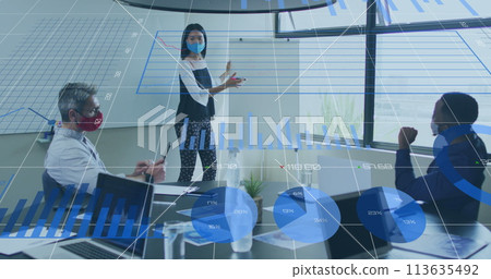 Image of financial data processing over diverse business people with face masks at meeting Image of financial data processing over diverse business people with face masks at meeting 113635492