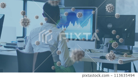 Image of virus cells over african american businesswoman with face mask using computer 113635494