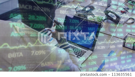 Image of financial data processing over businessman with face mask using laptop in office 113635561