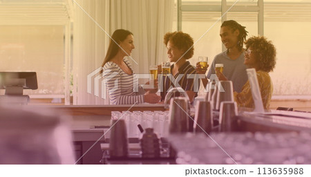 Friends enjoy drinks at a bar, with copy space Friends enjoy drinks at a bar, with copy space 113635988