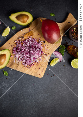 Chopped red Mars Onion on wooden cutting board at domestic kitchen Chopped red Mars Onion on wooden cutting board at domestic kitchen 113637797