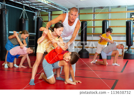 Young boys and girls on self-defence training 113638732