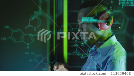 Image of data processing over african american male server room worker using headphones Image of data processing over african american male server room worker using headphones 113639408