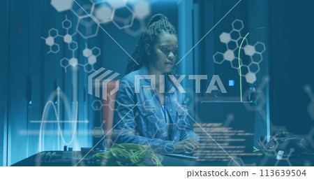 Image of data processing over african american female server room worker using laptop 113639504