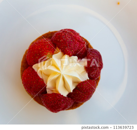 Strawberry dessert with cream on white plate Strawberry dessert with cream on white plate 113639723