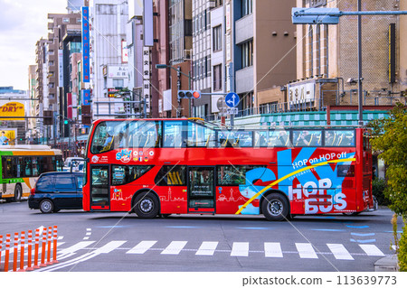 Tokyo cityscape in Japan Sky hop bus passing in front of Asakusa Station and about to turn towards Sensoji Temple (backward) = 18th 113639773