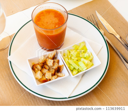 Glass of gazpacho with cucumber and croutons Glass of gazpacho with cucumber and croutons 113639911