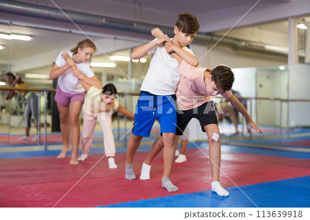 Two boys practicing self-defense moves 113639918