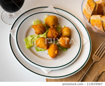 Bunuelos de bacalao - traditional Spanish cod fritters closeup 113639967