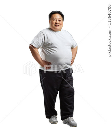 Full-length portrait of an overweight man with his hands on his hips 113640706