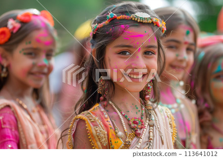 Indian girls celebrating Holi festival with traditional dresses and ornaments 113641012
