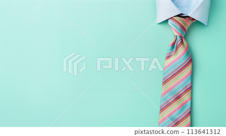 Blue background with a colorful striped tie. Blue background with a colorful striped tie. 113641312