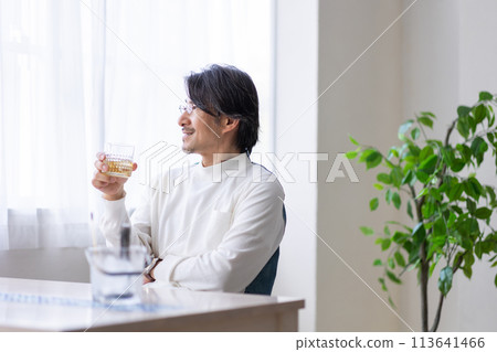 Man drinking whiskey Man drinking whiskey 113641466