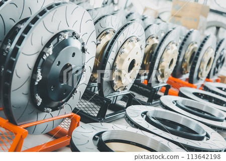Checking car brake system for repair at car garage 113642198