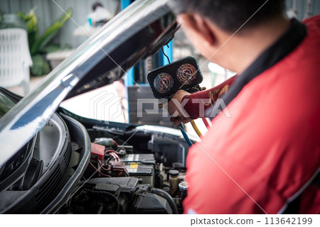 Car refilling air condition at car garage 113642199