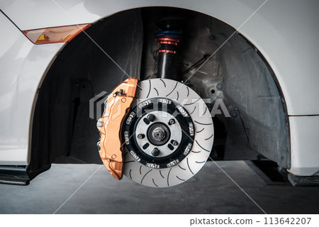 Checking car brake system for repair at car garage 113642207