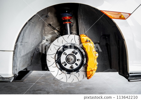 Checking car brake system for repair at car garage 113642210