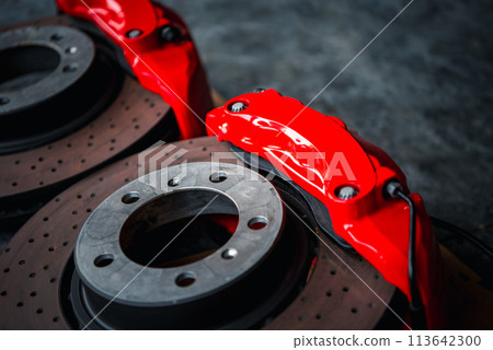 Checking car brake system for repair at car garage Checking car brake system for repair at car garage 113642300