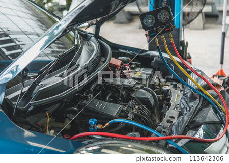 Car refilling air condition at car garage Car refilling air condition at car garage 113642306