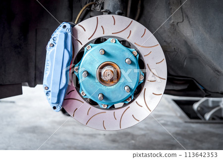 Checking car brake system for repair at car garage 113642353